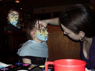Cara having her face painted