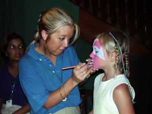 Cara having her face painted.